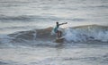 Kovalam, Chennai, Tamilnadu, India - Ã¢â¬Å½Ã¢â¬Å½August 9th Ã¢â¬Å½2021: Young boy Indian surfer surfing and practicing on the beach waves Royalty Free Stock Photo